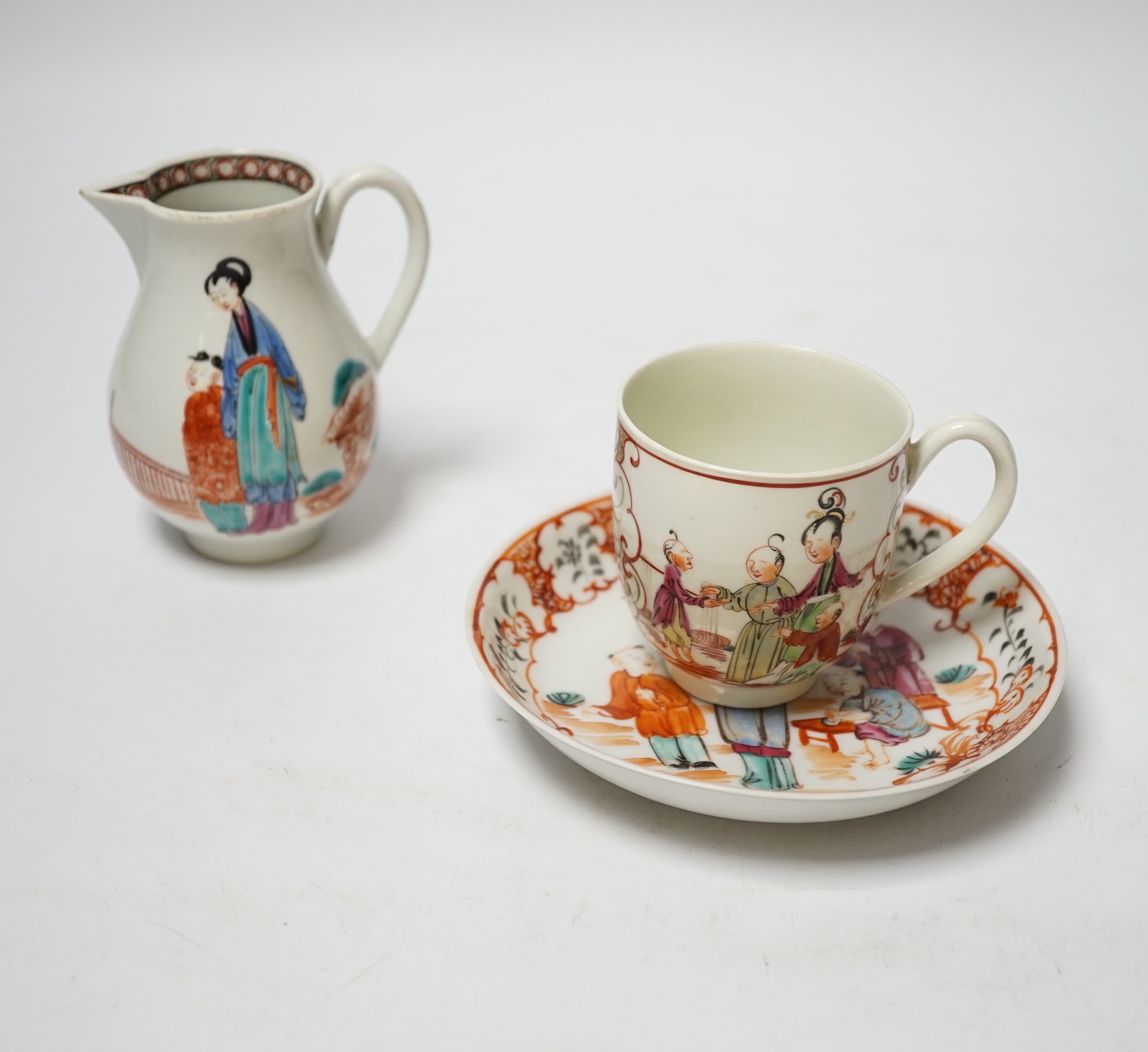 A Worcester sparrowbeak jug and a similar coffee cup together with an 18th century Chinese export saucer, 13cm diameter